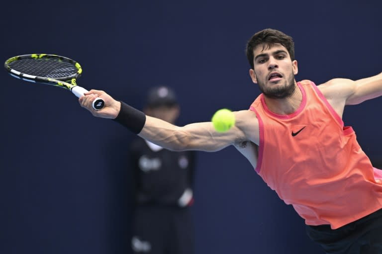 Spain's Carlos Alcaraz hits a return to France's Giovanni Mpetshi Perricard during their match at the China Open on Friday (WANG Zhao)