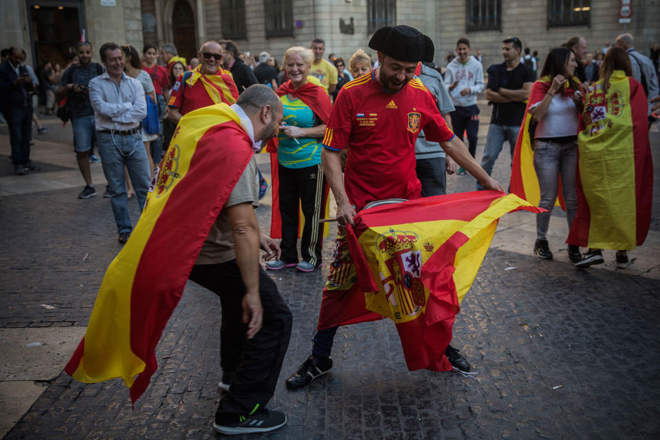 <p>Men perform a bullfighting game outside the Palau Generalitat after a mass rally against Catalonia’s declaration of independence, in Barcelona, Spain, Sunday, Oct. 29, 2017. (Photo: Santi Palacios/AP) </p>