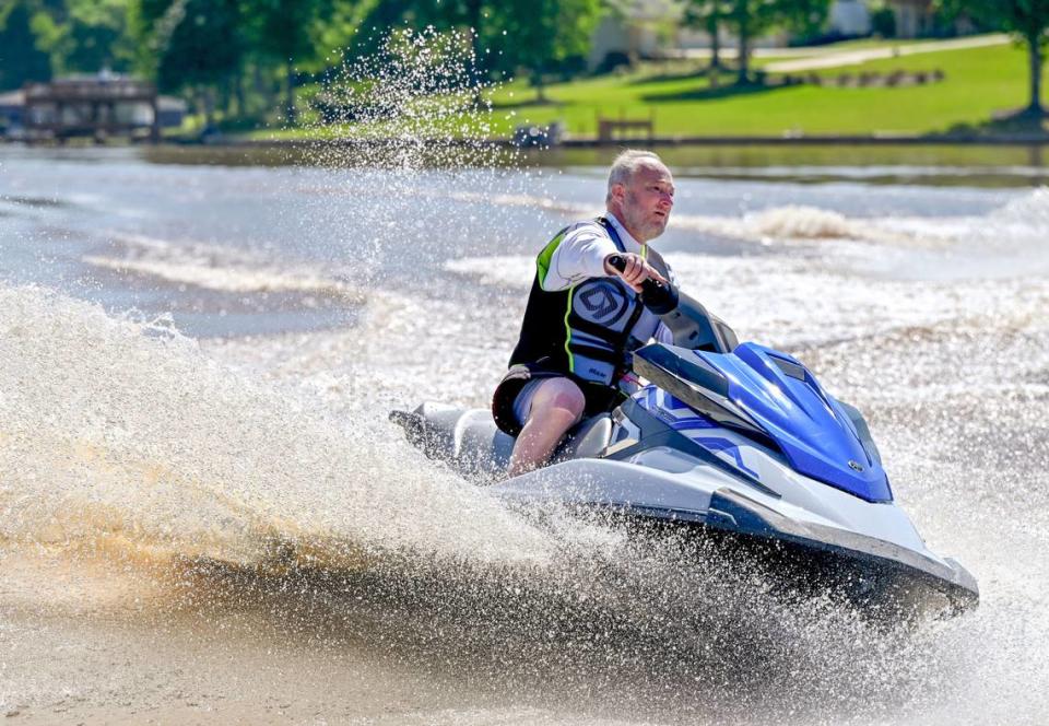 Macon-Bibb County Mayor Lester Miller rides a jet ski near Sandy Beach Park at Lake Tobesofkee Wednesday morning. Miller helped announce that the American Jet Sport Association will host a competition at the lake this weekend..