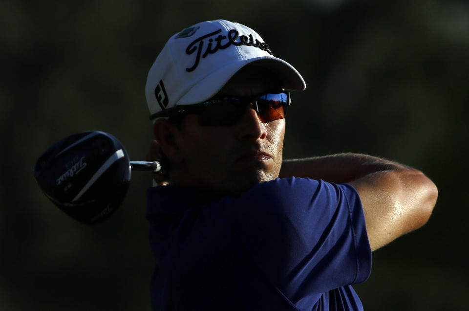 Adam Scott, of Australia, tees off during the third round of the Masters golf tournament Saturday, April 12, 2014, in Augusta, Ga. (AP Photo/David J. Phillip)