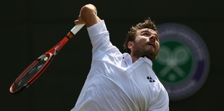 Switzerland's Stan Wawrinka serves against Spain's Fernando Verdasco in their third-round match at Wimbledon on July 3, 2015