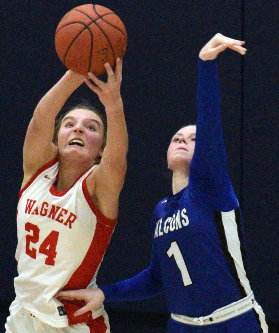 Florence-Henry's Haley Hlavacek tries to deny a post pass intended for Wagner's Ashlyn Koupal during their matchup in the Sacred Hoops Classic on Saturday, Jan. 27, 2024 at Laddie E. Cimpl Arena in Yankton.