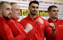 Iranian taekwondo competitor Farzad Zolghadri and the head of Bulgarian Taekwondo Federation Slavi Binev pose for pictures after attending a news conference at Vasil Levski stadium in Sofia