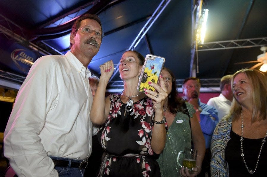 Doug Smith and his wife, Lisa Smith, celebrate Tuesday, Aug 30, 2016, at the Kona Beach Cafe in Jensen Beach after Doug Smith won the Republican primary for the Martin County Commission District 1 seat. He will face write-in candidate Chase Lurgio in the general election on Nov. 8. (JEREMIAH WILSON/TREASURE COAST NEWSPAPERS)