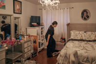 Gabriela Durham, 17, takes her shoes off inside her room on Saturday, Jan. 27, 2024, in New York. No longer just a distraction or a way to connect with friends, social media has matured into a physical space and a community that almost all U.S. teenagers belong to. Up to 95% of teenagers say they use social media, with more than one-third saying they are on it “almost constantly,” according to the Pew Research Center. (AP Photo/Andres Kudacki)