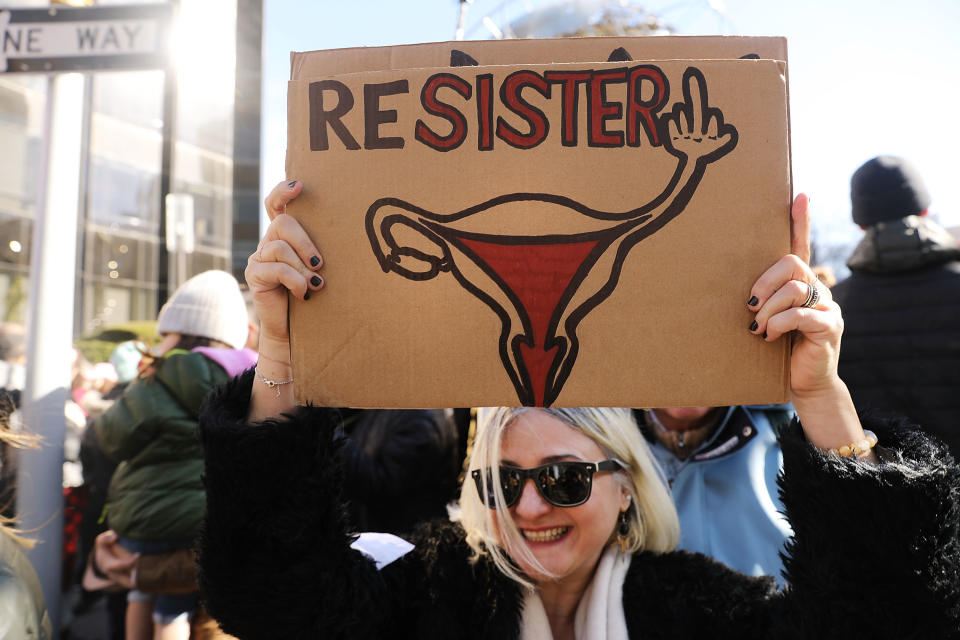 Woman holds sign at Women's March in New York City.&nbsp;