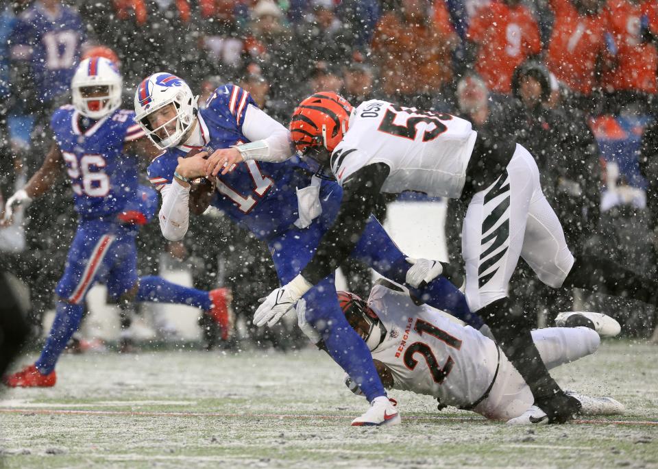 Bills quarterback Josh Allen is hit after a short gain against the Bengals. 