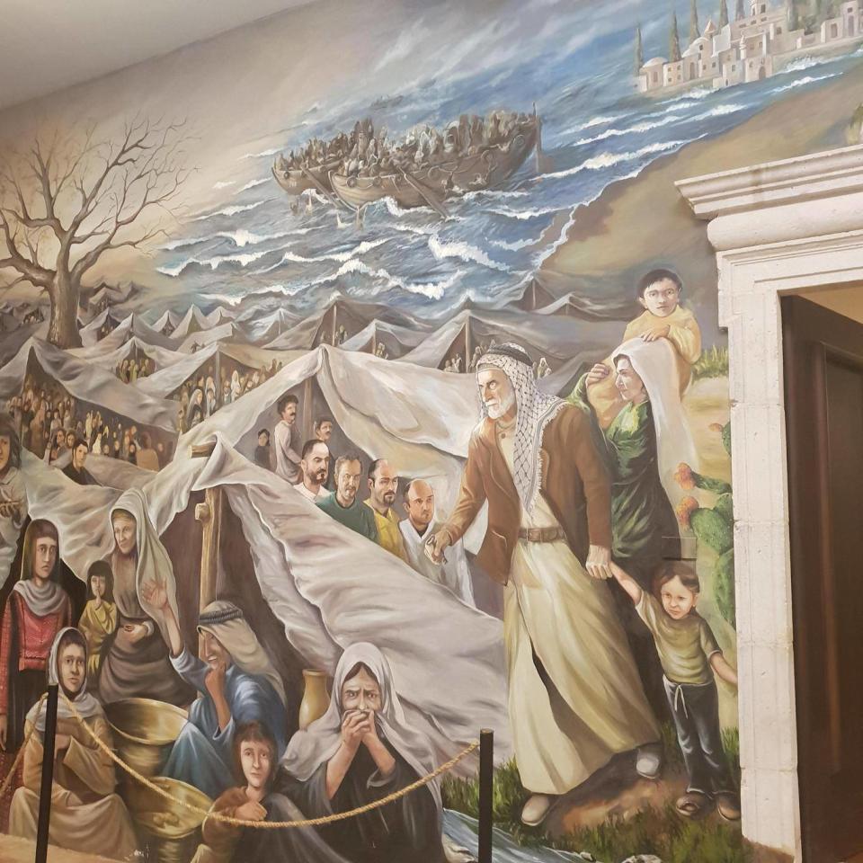 A wall-painting in the basement of Munib Musri's Italianate villa depicts the 'Nakba' – the Arab exodus from Palestine in 1948 (Nelofer Pazira)