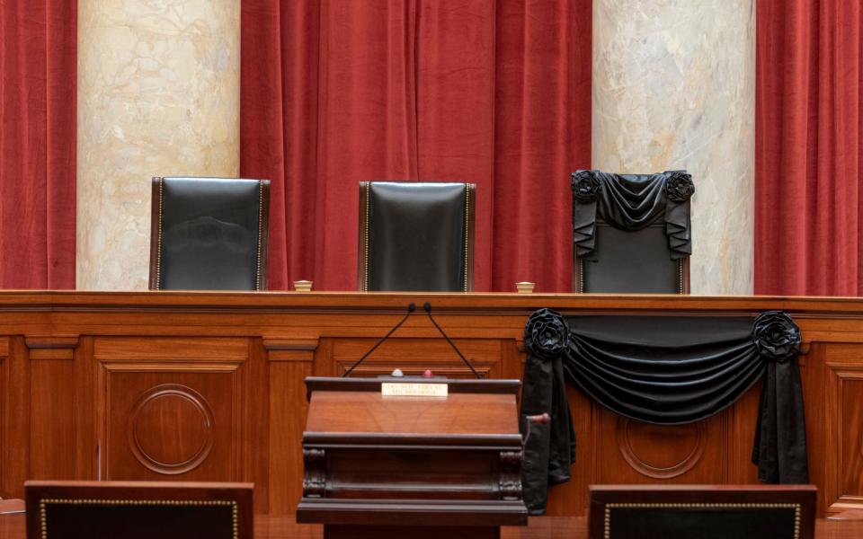 Justice Ruth Bader Ginsburg's chair is draped with black fabric  - Fred Schilling/Collection of the Supreme Court of the United States via AP