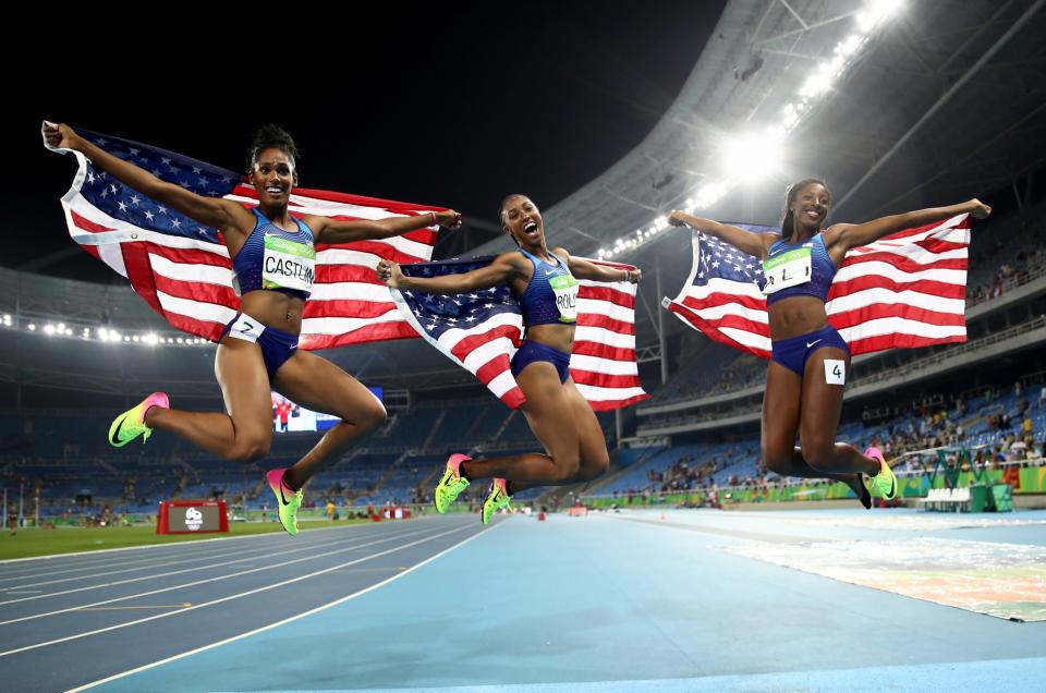 <p>Bronze medalist Kristi Castlin, gold medalist Brianna Rollins and silver medalist Nia Ali of Team USA swept the 100-meter hurdles - the first time any country has ever done so. (Getty) </p>