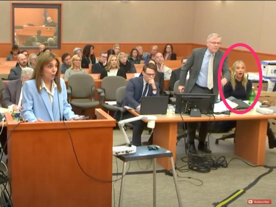 Gwyneth Paltrow and a row of lawyers sit in court.