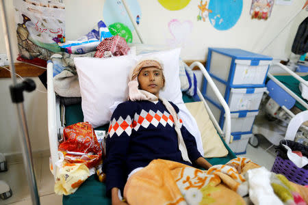 A boy lies on a bed at a cancer treatment center in Sanaa, Yemen, February 11, 2017. REUTERS/Khaled Abdullah