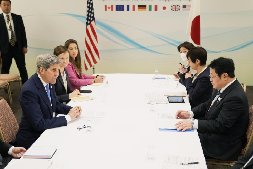 U.S. Special Presidential Envoy for Climate John Kerry, left, and Japan's Environment Minister Akihiro Nishimura, right, prepare to start their bilateral meeting in the G-7 ministers' meeting on climate, energy and environment in Sapporo, northern Japan, Saturday, April 15, 2023. (AP Photo/Hiro Komae)