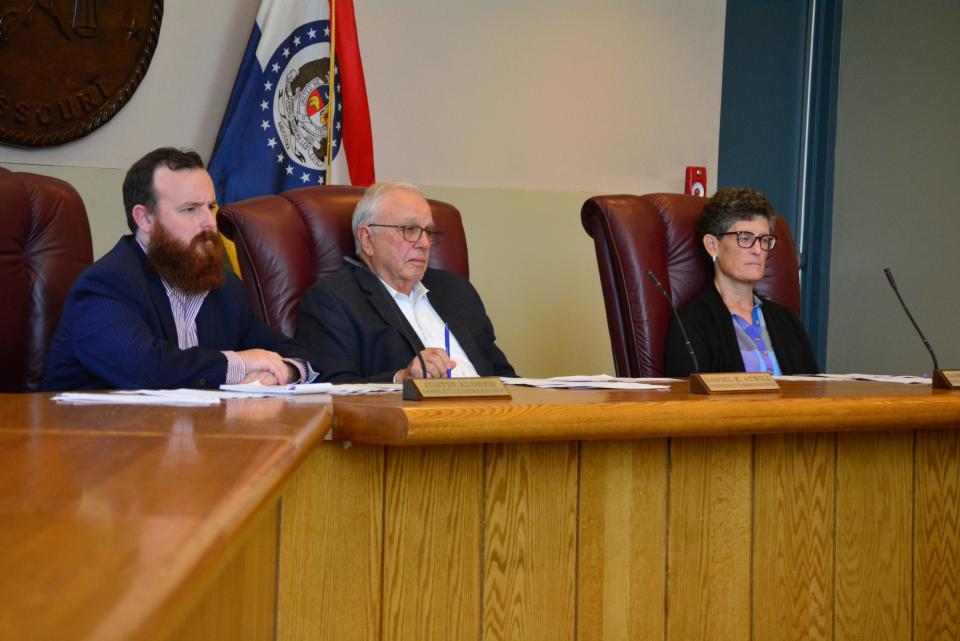 From left, Boone County Commission members Justin Aldred, Dan Atwill and Janet Thompson listen Thursday to Willy Schlacks (not pictured), president of EquipmentShare, as he participates in a presentation about his company's Chapter 100 tax incentive application.