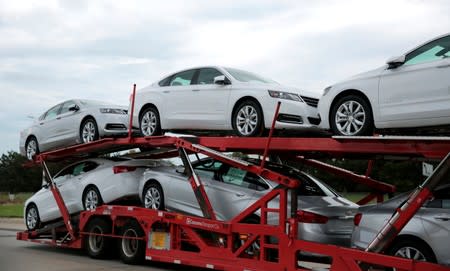 Car hauler transports newly built Chevrolet Impalas from the General Motors Detroit-Hamtramck plant in Detroit
