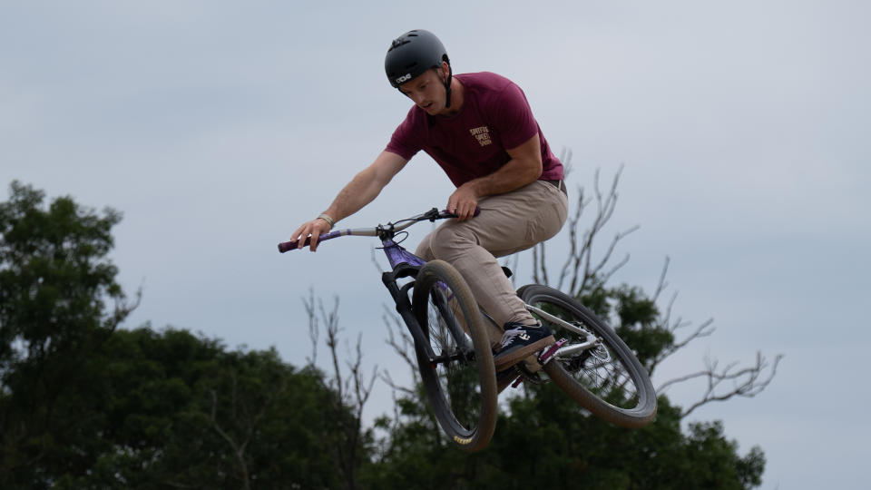 A BMX rider doing a jump on a track