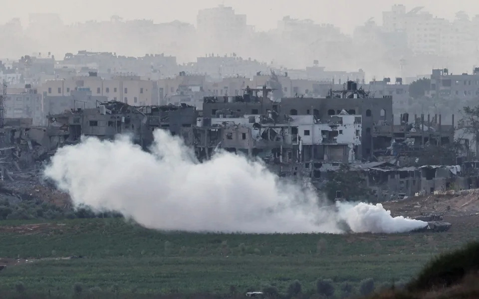 An Israeli tank manoeuvres inside the Gaza Strip, as seen from the Israel border