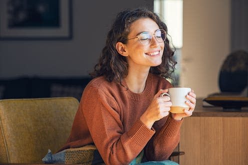 <span class="caption">'Lucky girl syndrome' is similar to the 'law of attraction'.</span> <span class="attribution"><a class="link " href="https://www.shutterstock.com/image-photo/happy-young-woman-drinking-cup-tea-2042836916" rel="nofollow noopener" target="_blank" data-ylk="slk:Ground Picture/ Shutterstock;elm:context_link;itc:0;sec:content-canvas">Ground Picture/ Shutterstock</a></span>