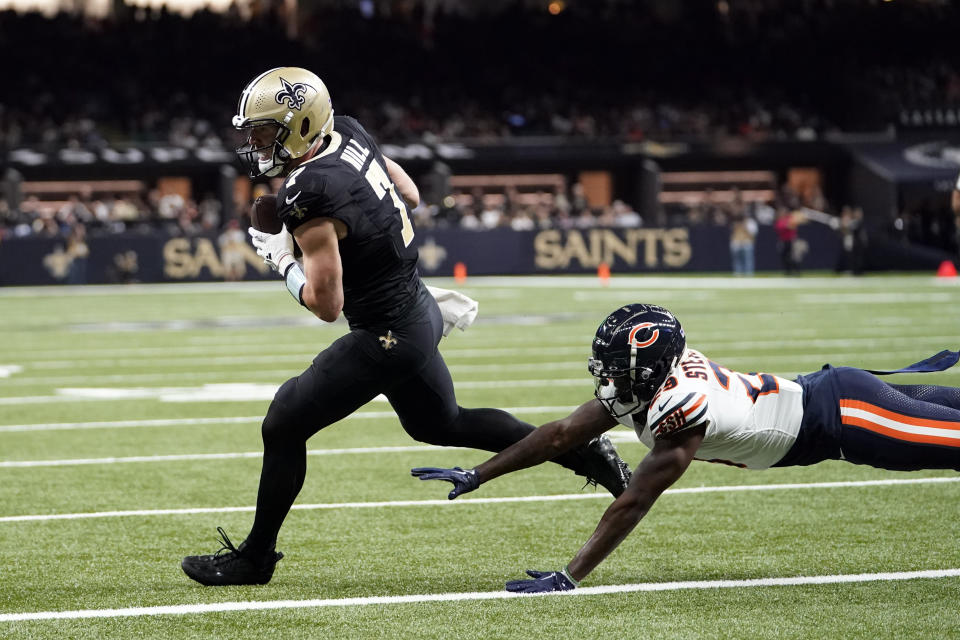 New Orleans Saints' Taysom Hill (7) make a touchdown catch past Chicago Bears cornerback Tyrique Stevenson during the first half of an NFL football game in New Orleans, Sunday, Nov. 5, 2023. (AP Photo/Gerald Herbert)