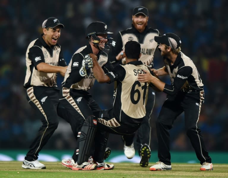 New Zealand's bowler Ish Sodhi (C) celebrates with teammates after taking the wicket of India's batsman Ravindra Jadeja during their World T20 tournament match in Nagpur, on March 15, 2016