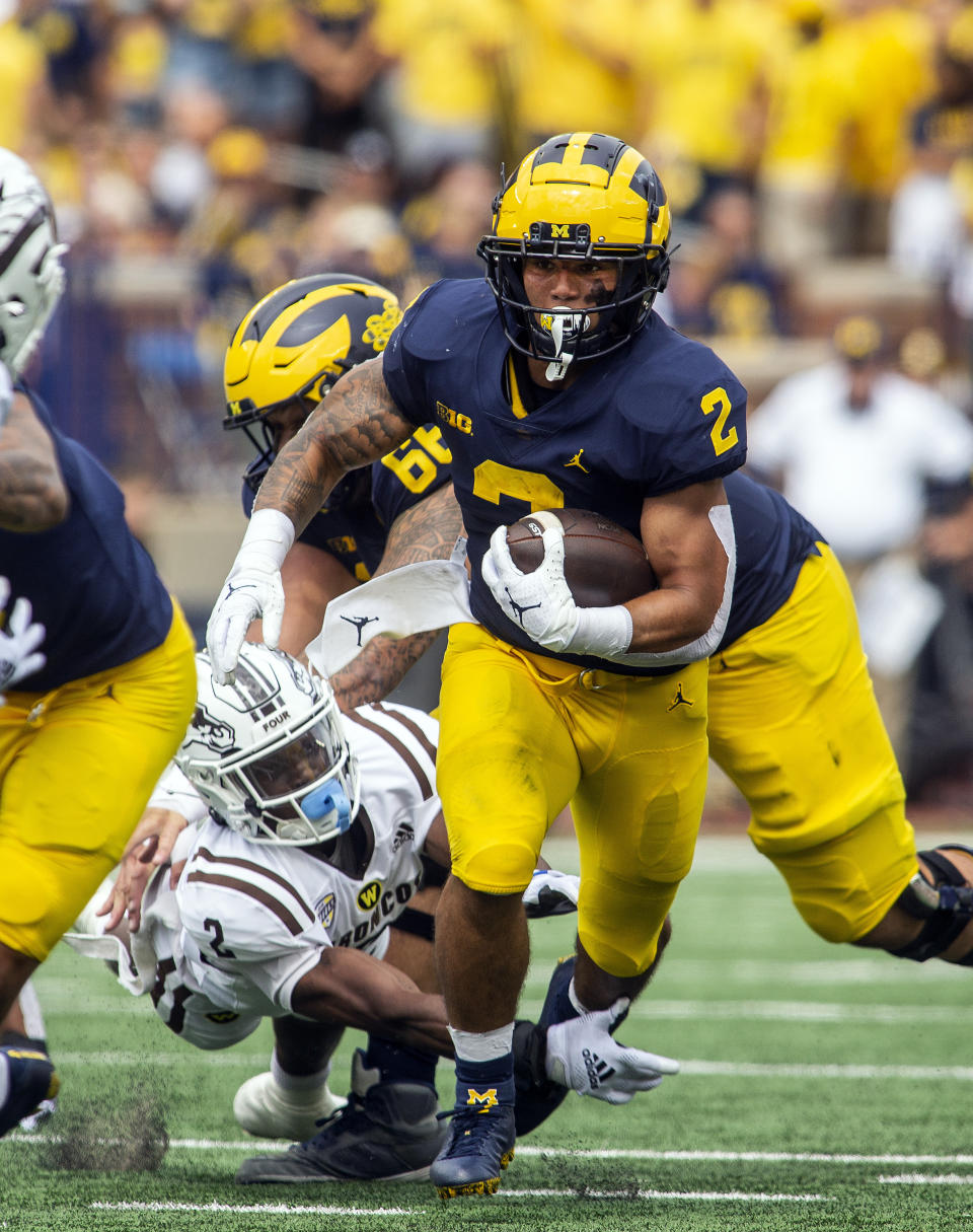 Michigan running back Blake Corum (2) rushes in the first quarter of an NCAA college football game against Western Michigan in Ann Arbor, Mich., Saturday, Sept. 4, 2021. (AP Photo/Tony Ding)