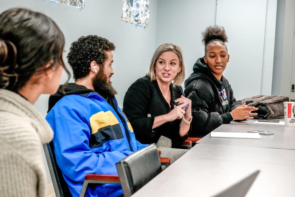 Foster Forward's executive director, Lisa Guillette, center, with Taylor Lee, right, and Joshua Guzman, former foster children who now serve as youth leaders with the agency, helping to shape its programs.