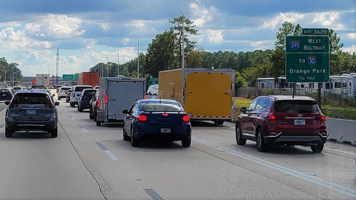 Slow traffic is shown on Interstate 95 South near an exit for I-295 East Beltway.