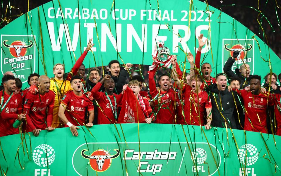 Jordan Henderson of Liverpool lifts the League Cup trophy - Carabao Cup final 2022/23: Date, kick-off time and favourites to win - Getty Images/Marc Atkins