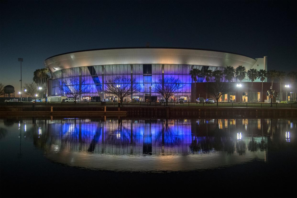 Stockton Arena glows purple at night in downtown Stockton.