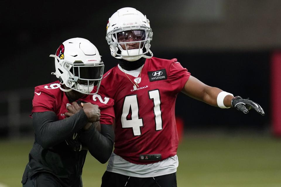 Arizona Cardinals running backs Chase Edmonds (29) and Kenyan Drake (41) run a drill during an NFL football workout Wednesday, Aug. 12, 2020, in Glendale, Ariz. (AP Photo/Ross D. Franklin)