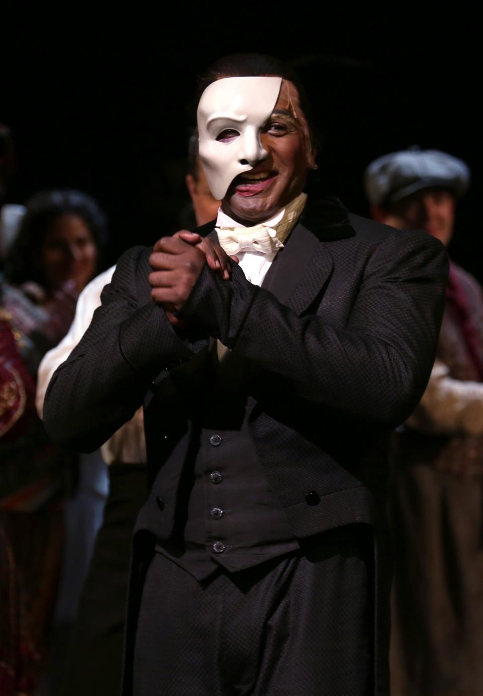 Norm Lewis in a white mask as the Phantom of the Opera