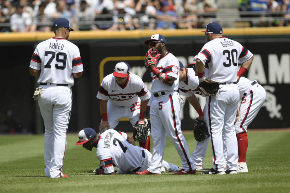 Chicago White Sox shortstop Tim Anderson lies on the field after being injured while throwing to first base during the fifth inning of a baseball game against the Chicago Cubs at Guaranteed Rate Field, Sunday, May 29, 2022, in Chicago. (AP Photo/Paul Beaty)