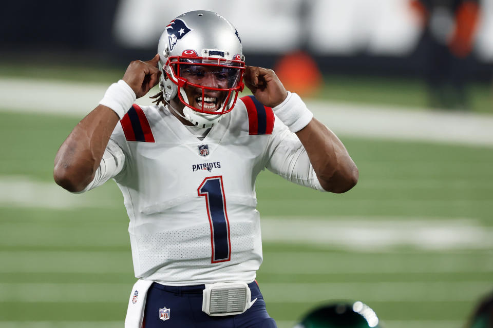 FILE - In this Nov. 9, 2020, file photo, New England Patriots quarterback Cam Newton (1) gestures at the line of scrimmage during an NFL football game against the New York Jets in East Rutherford, N.J. The college quarterbacks class is shaping up nicely, just in time to perhaps rescue some NFL teams from themselves. Those guys salivating about such prospects work in the personnel departments of the Jets, Jaguars and Bears. Maybe for the Lions, Patriots, Falcons, Saints and 49ers. (AP Photo/Adam Hunger, File)