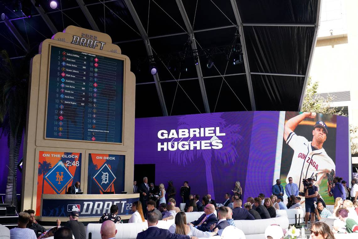 Gabriel Hughes’ name and photo are displayed on a screen at the MLB Draft in Los Angeles after the Colorado Rockies selected him with the 10th pick Sunday.