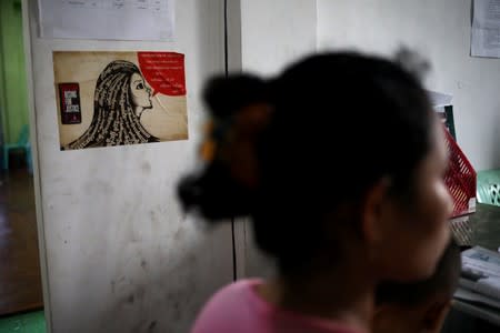 Nu Nu Aye, 22, speaks to a reporter at a shelter for abused women in Dawei