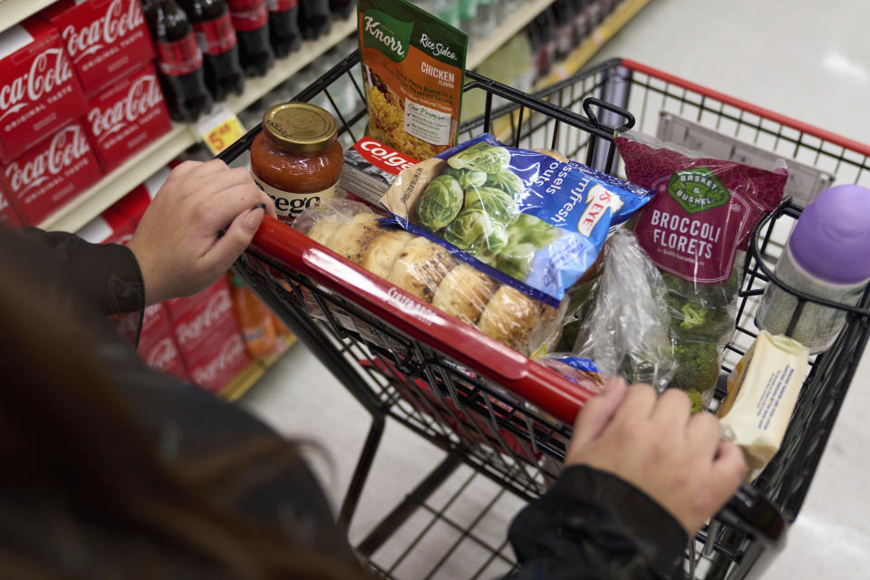 File - A food shopper pushes a cart of groceries at a supermarket in Bellflower, Calif., on Monday, Feb. 13, 2023. Student and legal advocacy groups are petitioning the U.S. Department of Agriculture to lift the interview requirement for Supplemental Nutrition Assistance Program (SNAP) applicants to receive food aid. SNAP helps low-income families supplement their budgets so they can buy groceries, snacks, and non-alcoholic beverages. An estimated 42 million Americans currently receive the benefits at an average of $212 per person or $401 per household. (AP Photo/Allison Dinner, File)