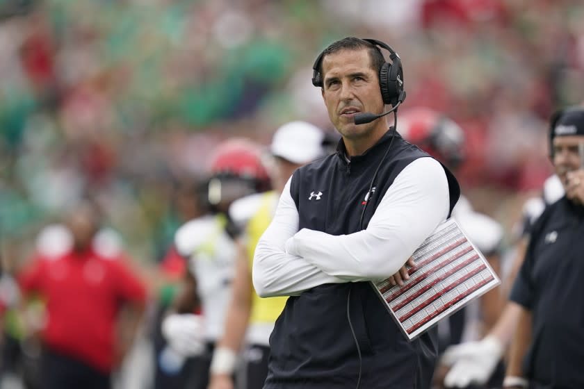 Cincinnati head coach Luke Fickell watches a replay during the first half of an NCAA college football game.