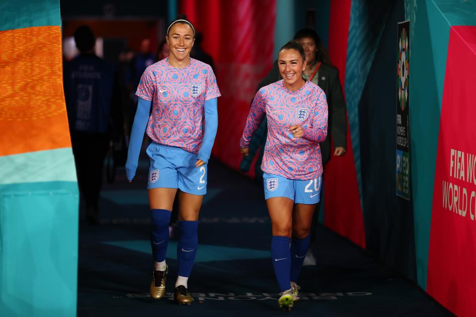 Lucy Bronze and Katie Zelem of England walk onto the pitch ahead of the semi-final (The FA via Getty Images)