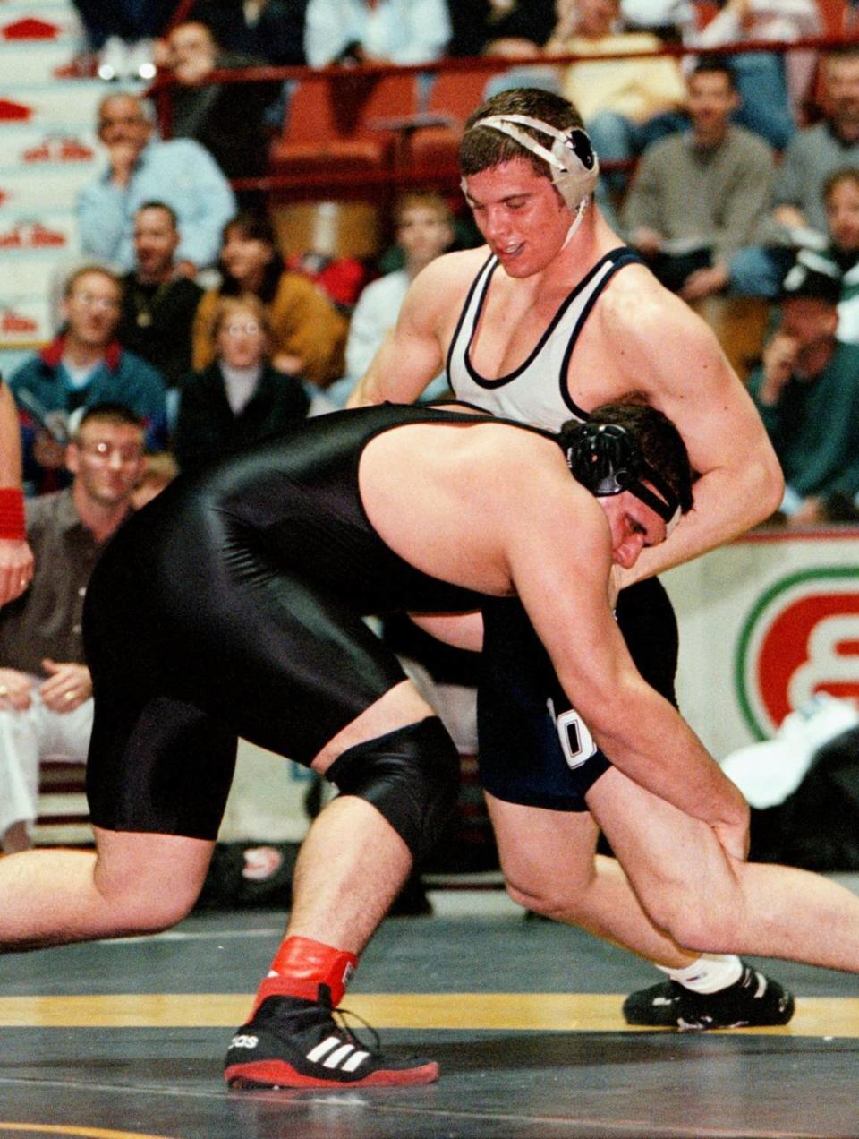 Philipsburg-Osceola’s Jon Condo, right, defends off a late single leg takedown try by Clearfield’s Tim Taylor in their AAA 275-pound semi-final match on Saturday, March 11, 2000.