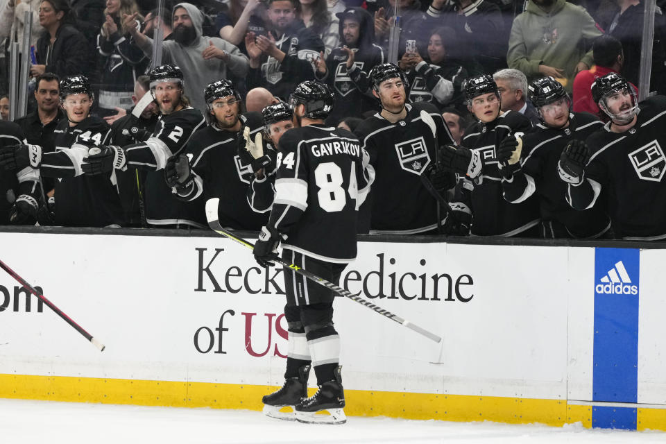 Los Angeles Kings' Vladislav Gavrikov (84) celebrates his goal with teammates during the second period of an NHL hockey game against the Washington Capitals Monday, March 6, 2023, in Los Angeles. (AP Photo/Jae C. Hong)