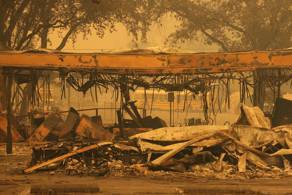A building from Paradise Unified School was burned down in Paradise as seen from Pearson Rd. 

The Northern California town of Paradise was a burned ghost town on Friday, Nov. 9, 2018, a day after the Camp Fire swept through. Most of the businesses on the Skyway were destroyed. Some schools were burned out. People escaping the fire abandoned their cars on the road. These are the ruins from a school building on Pearson Road. (Hung T. Vu/Special to the Record Searchlight)