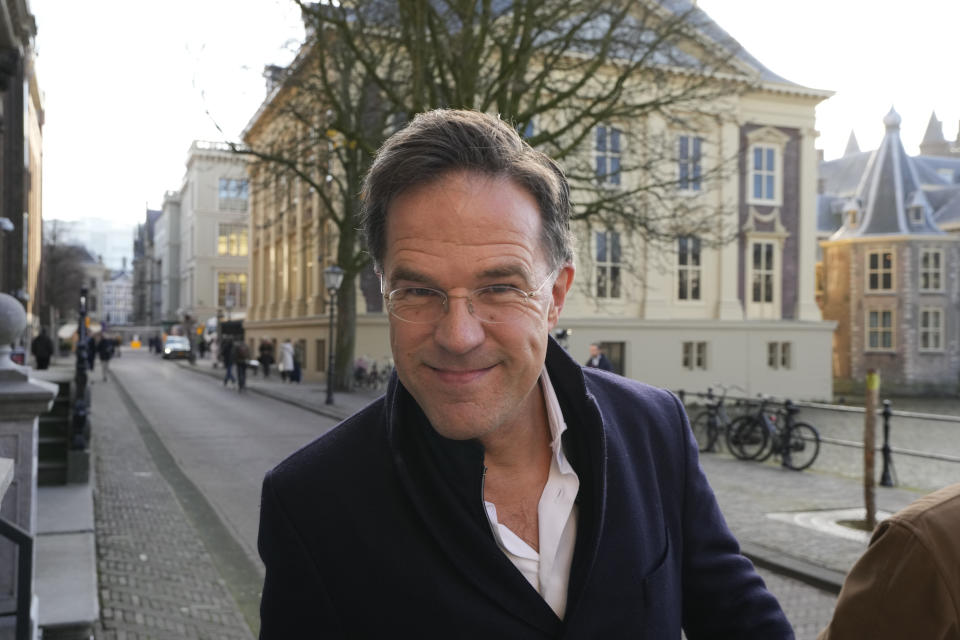 Caretaker Prime Minister Mark Rutte walks in the streets of The Hague, as his office Is seen in the right corner, one day after Wilders' far-right party PVV, or Party for Freedom, won the most votes in a general election, Netherlands, Thursday Nov. 23, 2023. (AP Photo/Peter Dejong)