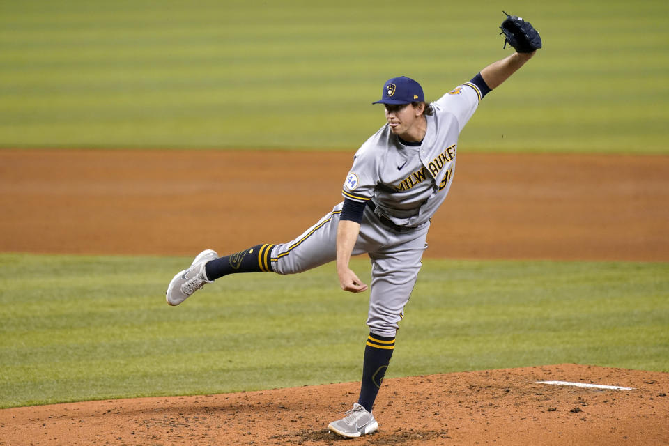 Milwaukee Brewers relief pitcher Patrick Weigel follows through on a delivery during the third inning of a baseball game, Friday, May 7, 2021, in Miami. (AP Photo/Lynne Sladky)