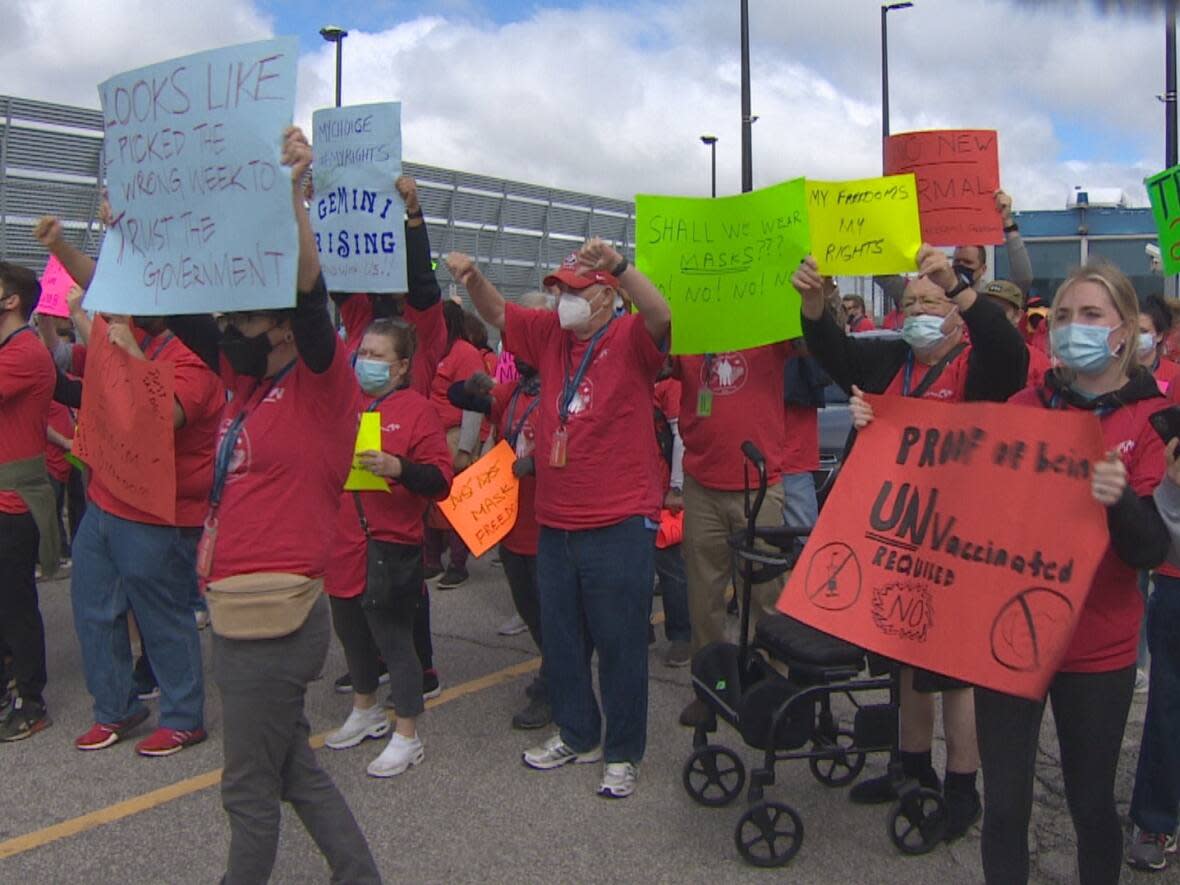 About 300 people, a mix of employees and volunteers, played the role of demonstrators at the protest on Electra Road near Convair Drive in Mississauga. The event was part of a mock emergency exercise organized by the Greater Toronto Airports Authority (GTAA), which operates the airport. (CBC - image credit)