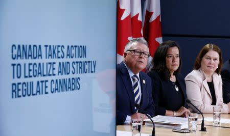 Canada's Public Safety Minister Ralph Goodale (L) speaks during a news conference with Justice Minister Jody Wilson-Raybould (C) and Health Minister Jane Philpott in Ottawa, Ontario, Canada, April 13, 2017. REUTERS/Chris Wattie