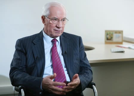 Former Ukrainian Prime Minister Mykola Azarov speaks during an interview with Reuters in Moscow