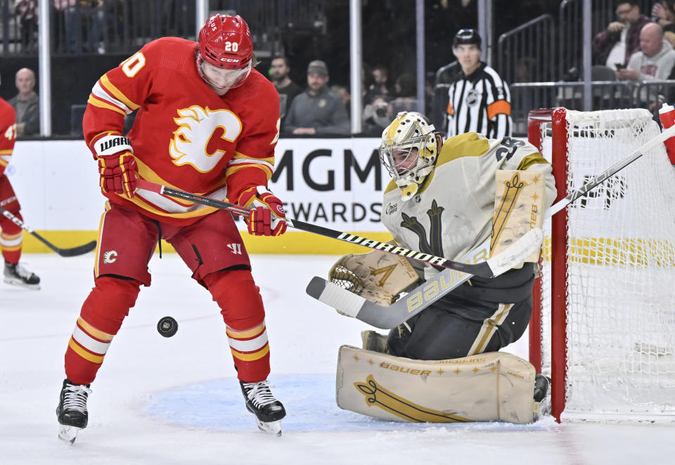 Calgary Flames center Blake Coleman (20) looks to take a shot against Vegas Golden Knights goaltender Logan Thompson (36) during the first period of an NHL hockey game Saturday, Jan. 13, 2024, in Las Vegas. (AP Photo/David Becker)