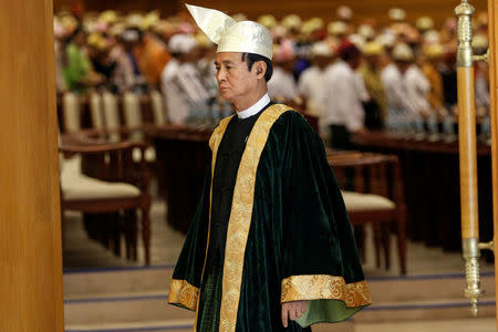 FILE PHOTO: Win Myint, speaker of Lower House of Parliament, leaves after attending a parliament meeting at Naypyitaw, Myanmar March 11, 2016. REUTERS/Soe Zeya Tun/File Photo