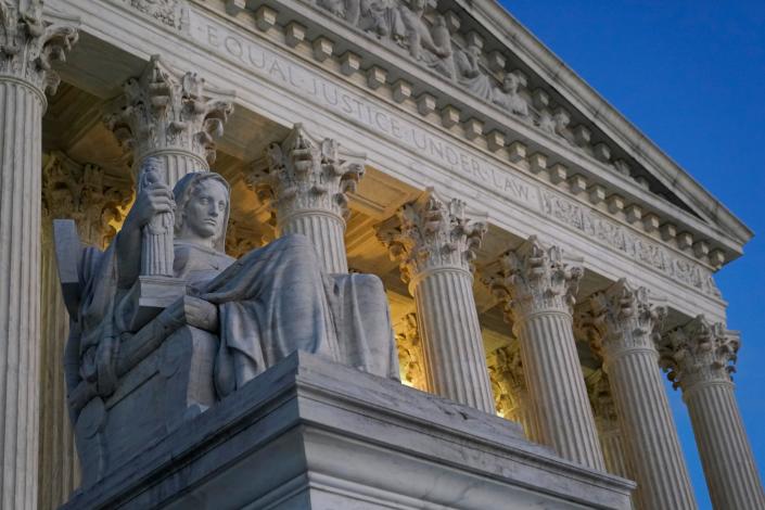 FILE- Light illuminates part of the Supreme Court building on Capitol Hill in Washington, Nov. 16, 2022. The Supreme Court will decide whether a disabled activist can file disability rights lawsuits against hotels she doesn't intend to visit. (AP Photo/Patrick Semansky, File) ORG XMIT: WX101