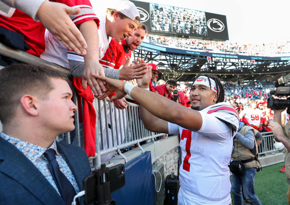 Oct. 29, 2022; University Park, Pennsylvania; Ohio State Buckeyes quarterback C.J. Stroud (7) shakes hands with the fans following the completion of the game against the Penn State Nittany Lions at Beaver Stadium. Ohio State defeated Penn State 44-31. Matthew O’Haren-USA TODAY Sports